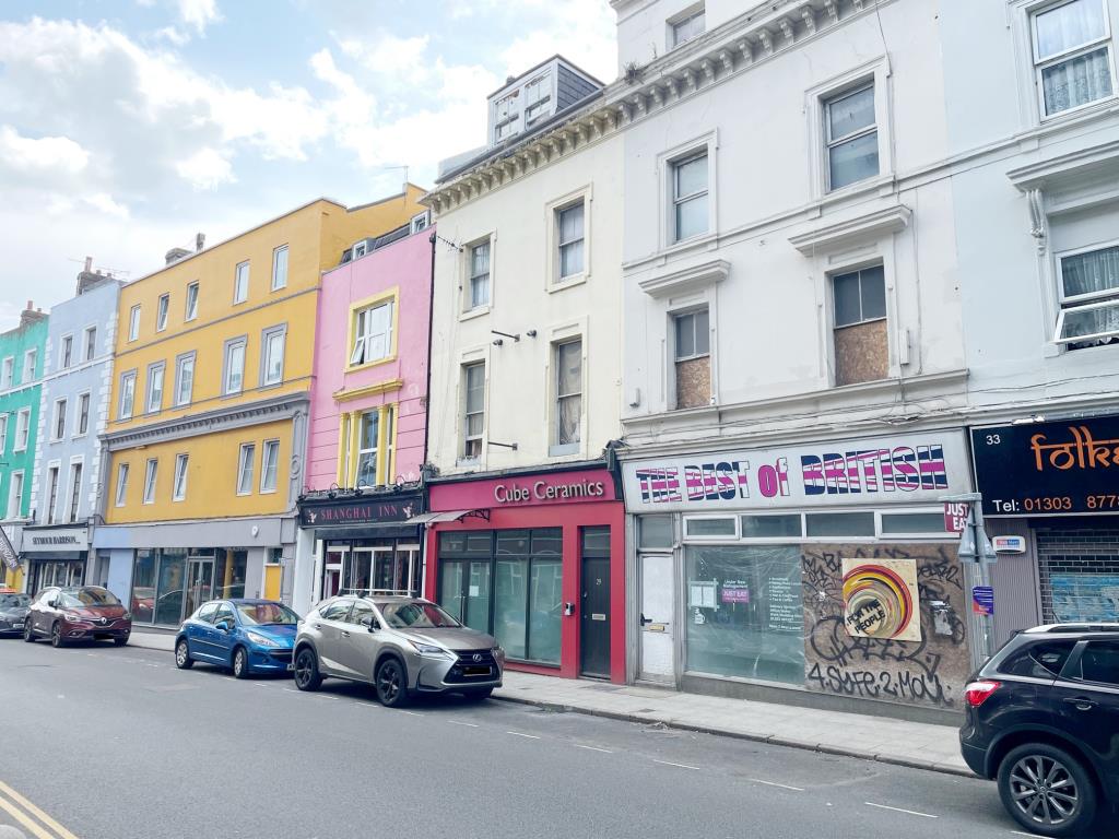 Lot: 56 - FORMER RESTAURANT AND UPPER PARTS WITH POTENTIAL - View down Tontine Street towards Folkestone Harboour